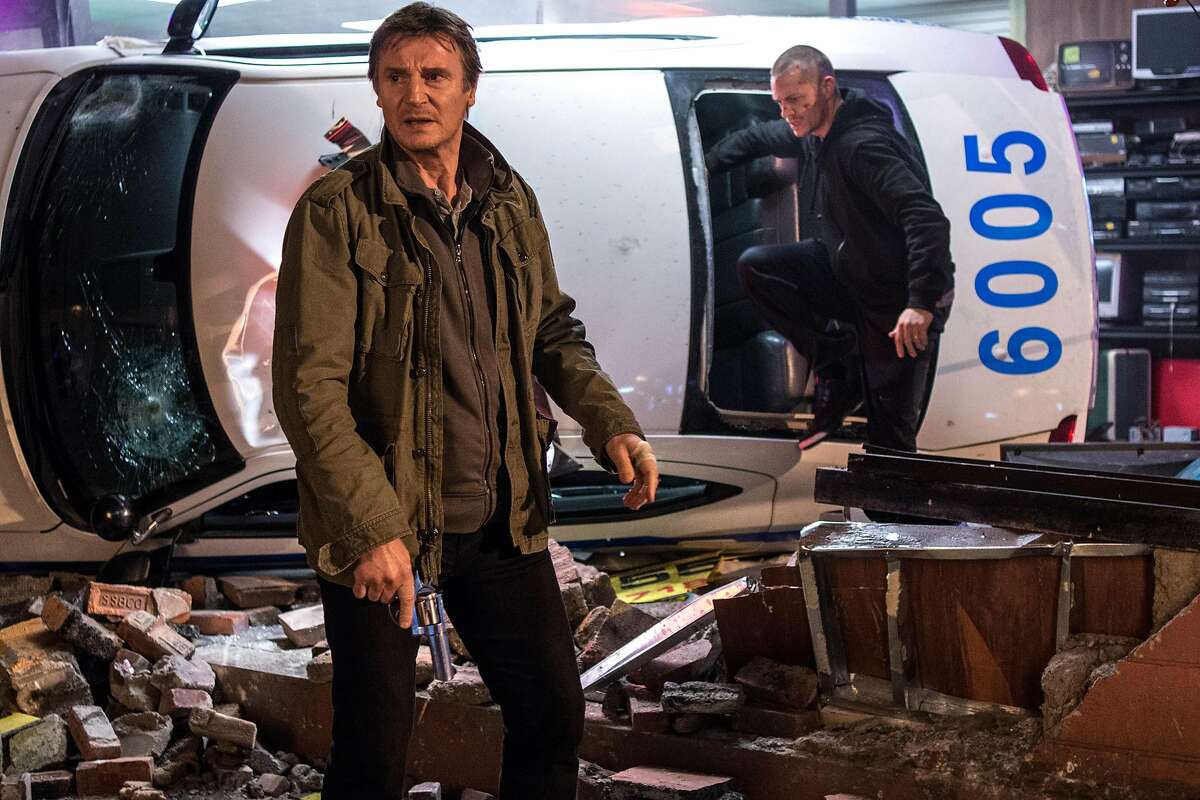 In this image released by Warner Bros. Pictures, Joel Kinnaman and Liam Neeson, left, appear in a scene from "Run All Night." (AP Photo/Warner Bros. Pictures, Myles Aronowitz)