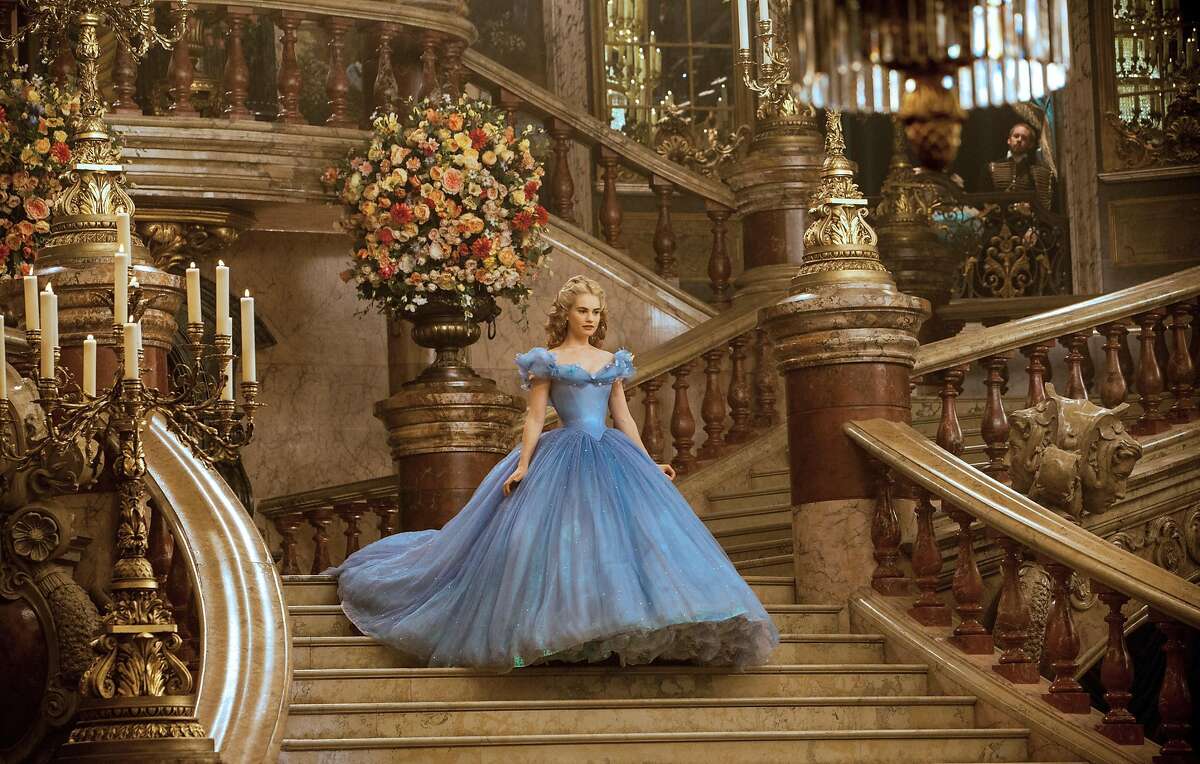 This image released by Disney shows Lily James as Cinderella in Disney's live-action feature inspired by the classic fairy tale, "Cinderella." (AP Photo/Disney, Jonathan Olley)