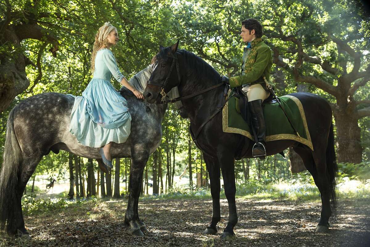 "Cinderella. image released by Disney shows Lily James as Cinderella, ...