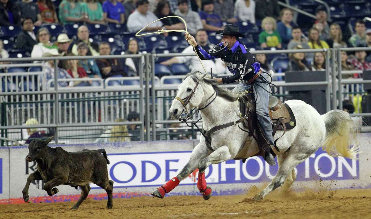 Josh Peek prepares to rope a calf in the tie-down roping competition during the Houston Livestock Show and Rodeo at NRG Stadium, Wednesday, March 11, 2015, in Houston. Peek won the series.