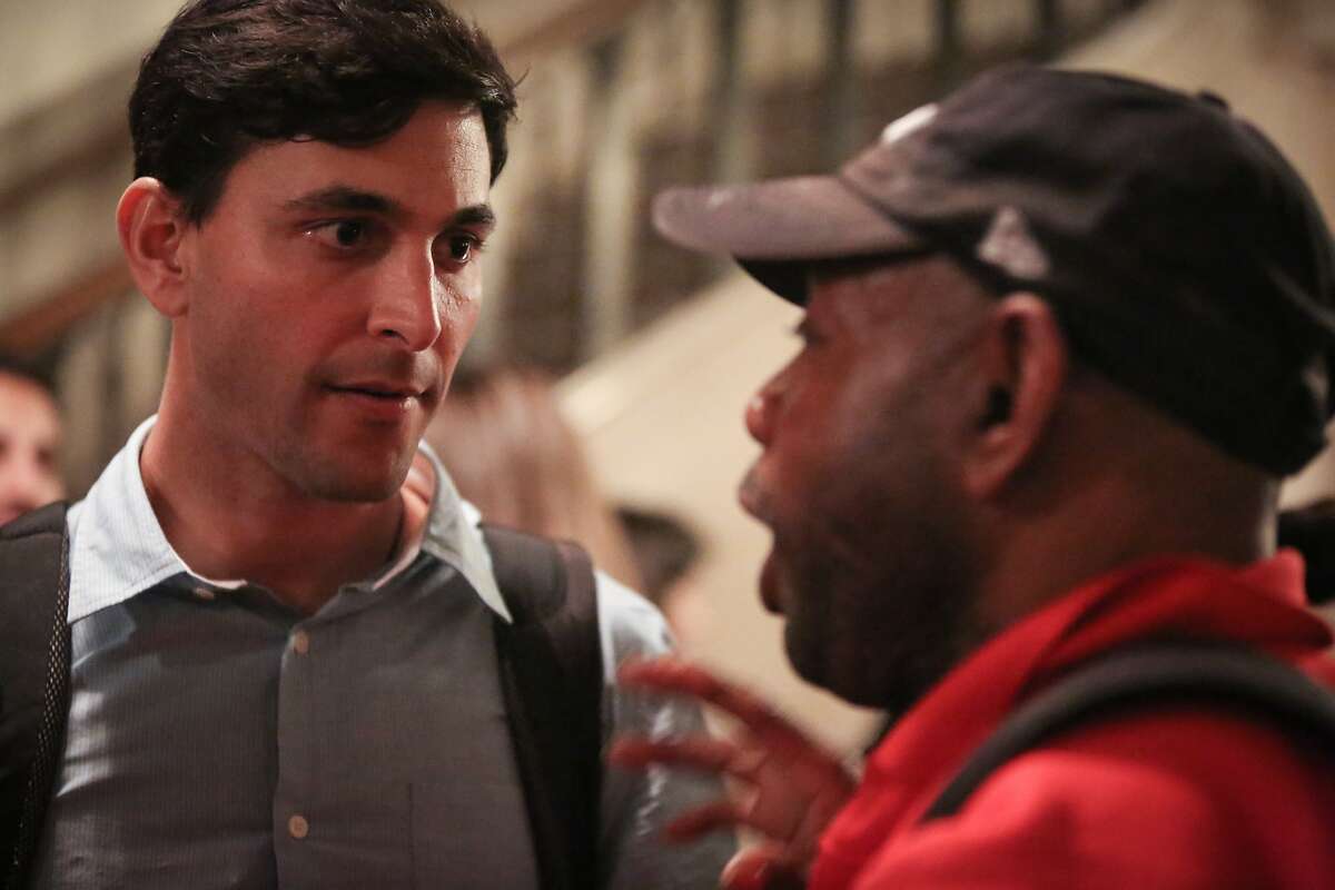 Darcel Jackson, a San Franciscan who has been homeless for two years due to unemployment, confronts Greg Gopman about an unanswered email regarding ideas that could help the homeless at the Nourse Auditorium on Wednesday, March 11, 2015.