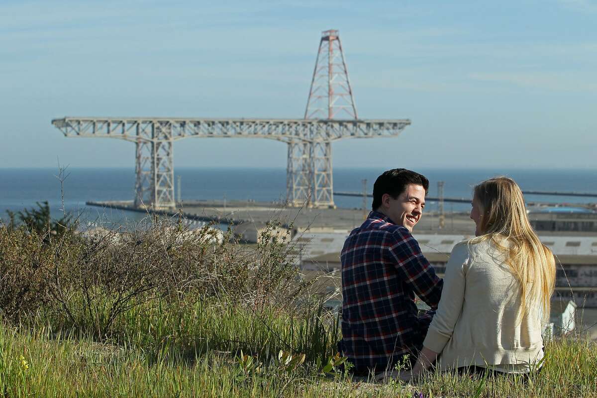 Ryan Lyles (left) and his wife Angela enjoy the view near their new condo at the S.F. Shipyard, Monday, March 9, 2015, in San Francisco, Calif.