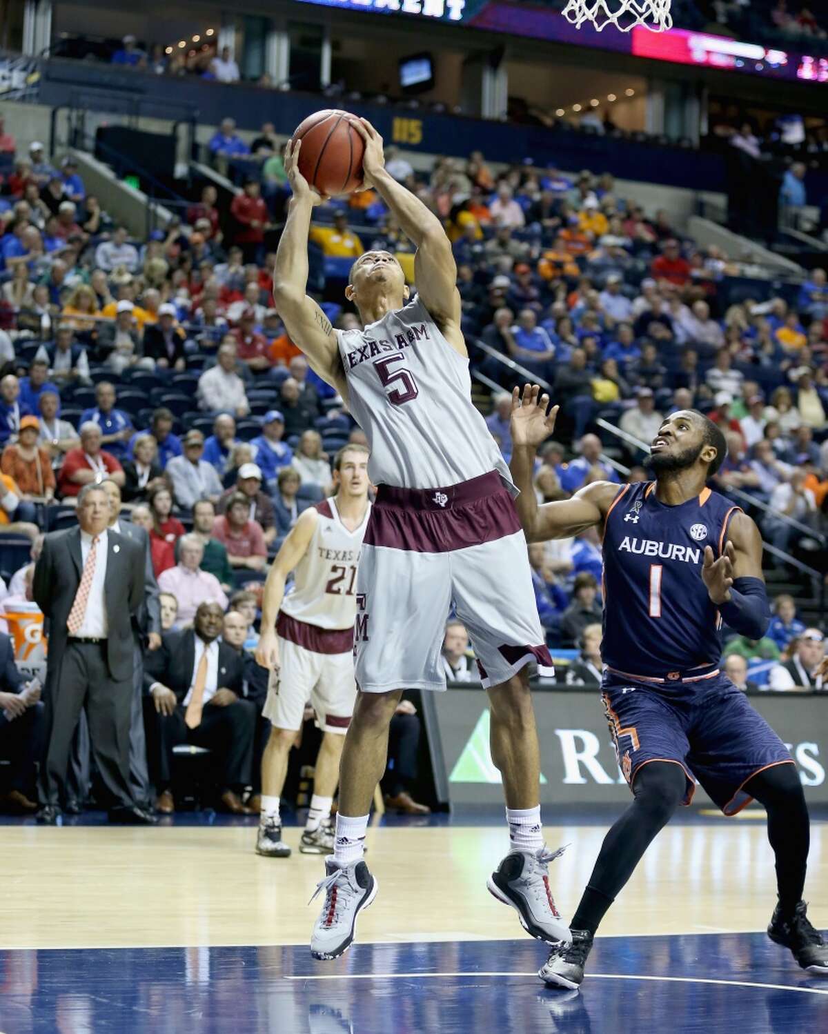 NASHVILLE, TN - MARCH 12: Jordan Green #5 of the Texas A&M Aggies shoots the ball against the Auburn Tigers during the second round game of the SEC Basketball Tournament at Bridgestone Arena on March 12, 2015 in Nashville, Tennessee. (Photo by Andy Lyons/Getty Images)