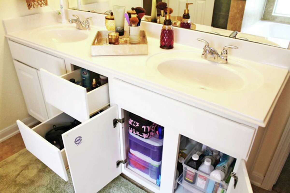 A tray on the vanity can corral items used every day.