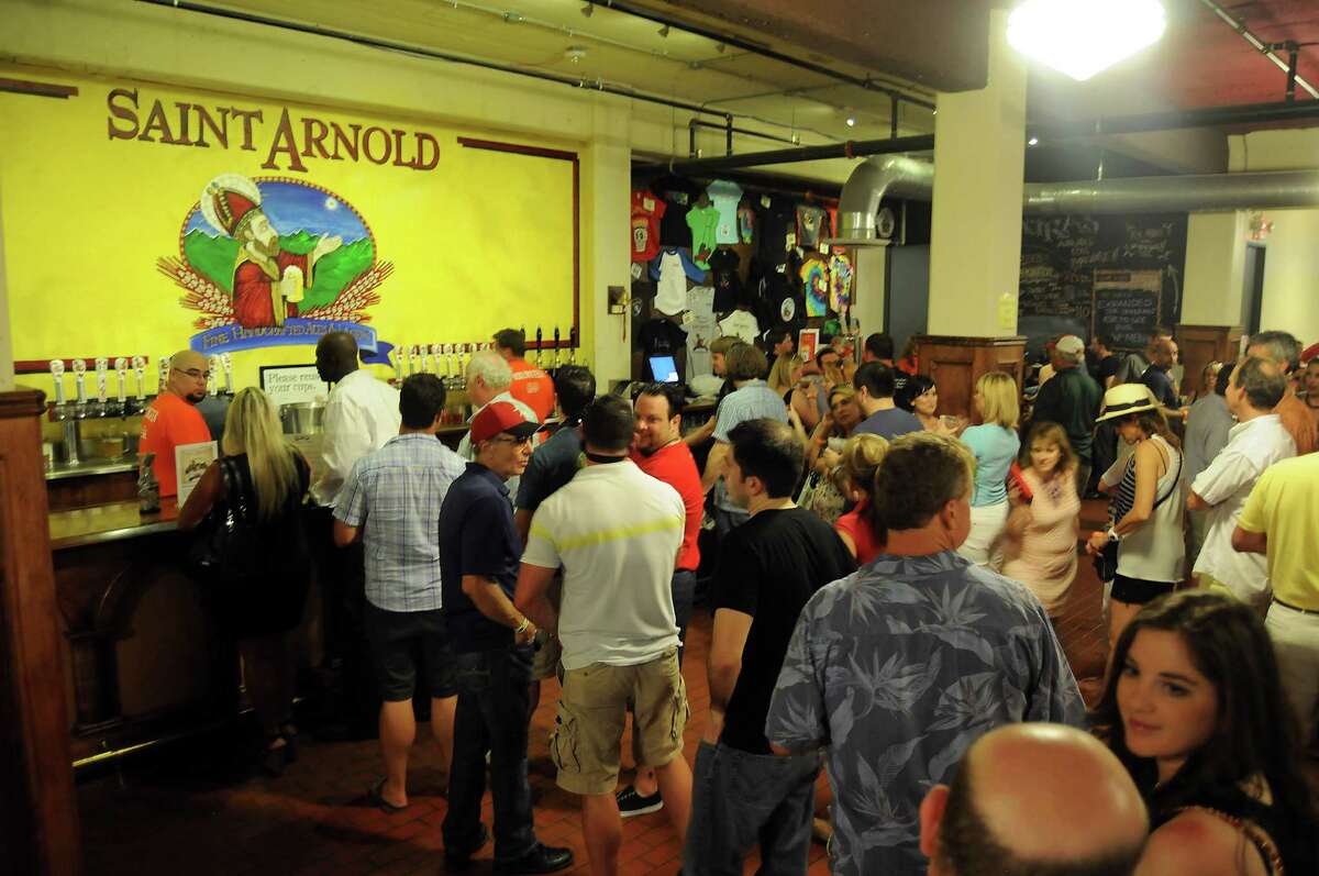 Guests wait for pints at Saint Arnold Brewing Co. Brock Wagner, owner of Saint Arnold Brewing Co., says craft brewers are not seeking to replace traditional retailers.