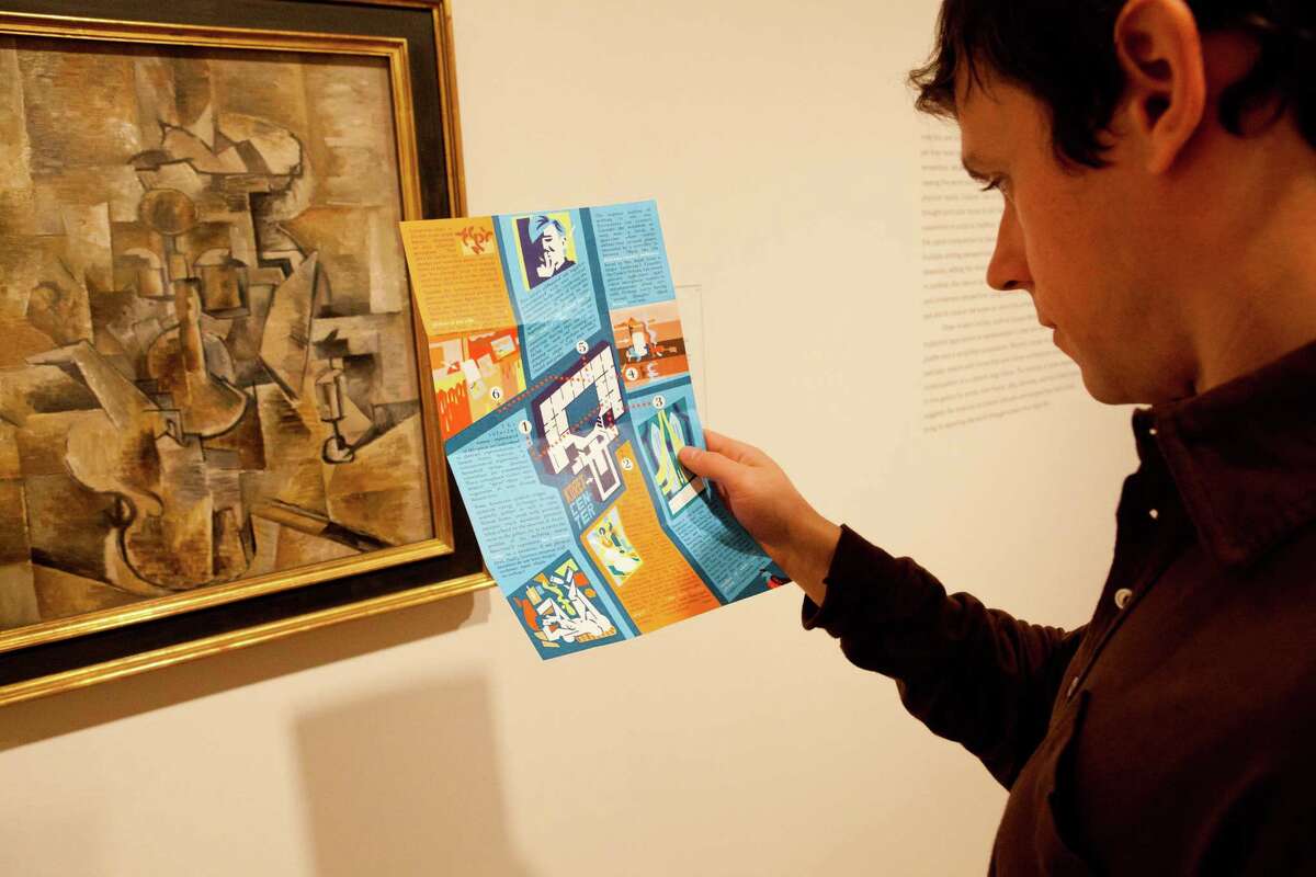 A museum visitor interacts with one of the games presented during a 2012 exhibit called “ArtGameLab“ at SFMOMA.