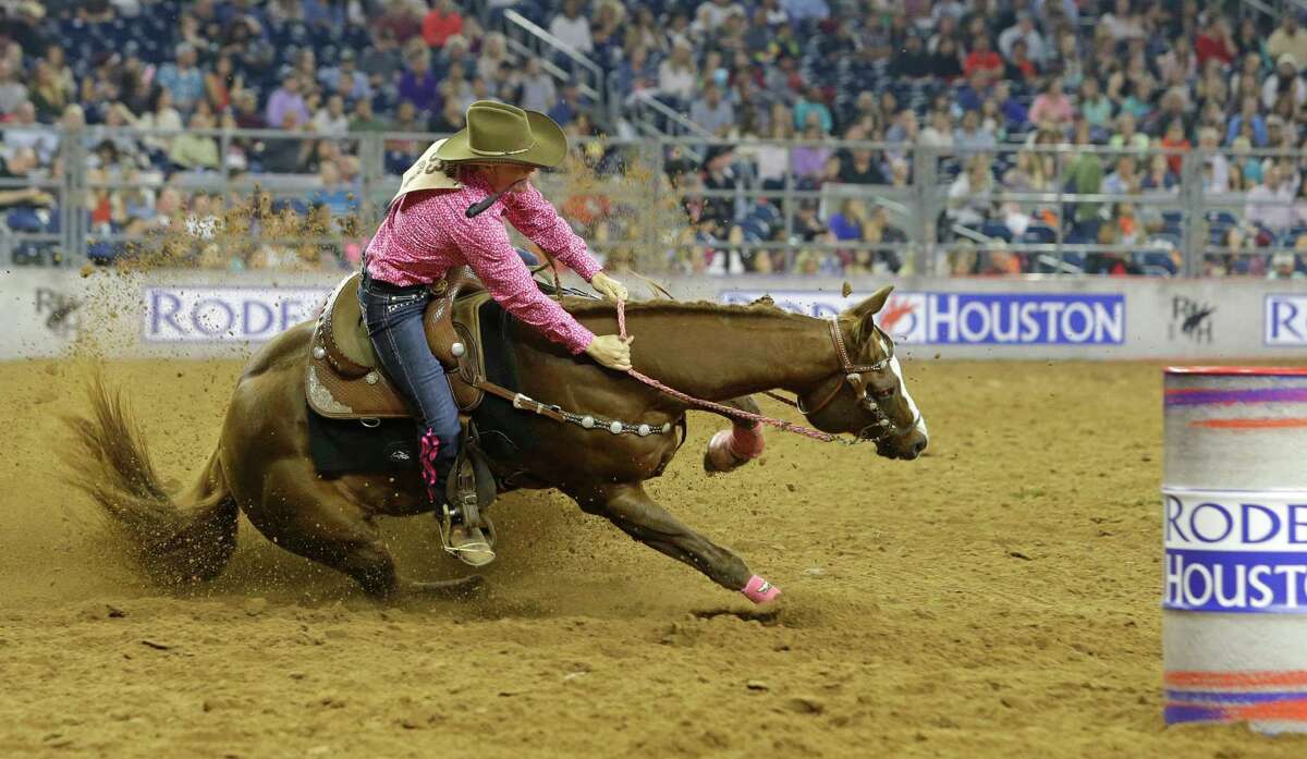Kelley Carrington rides in the barrel racing event during RodeoHouston at the Houston Livestock Show and Rodeo in NRG Stadium Wednesday, March 4, 2015, in Houston. Her horse stumbled near the first barrel.