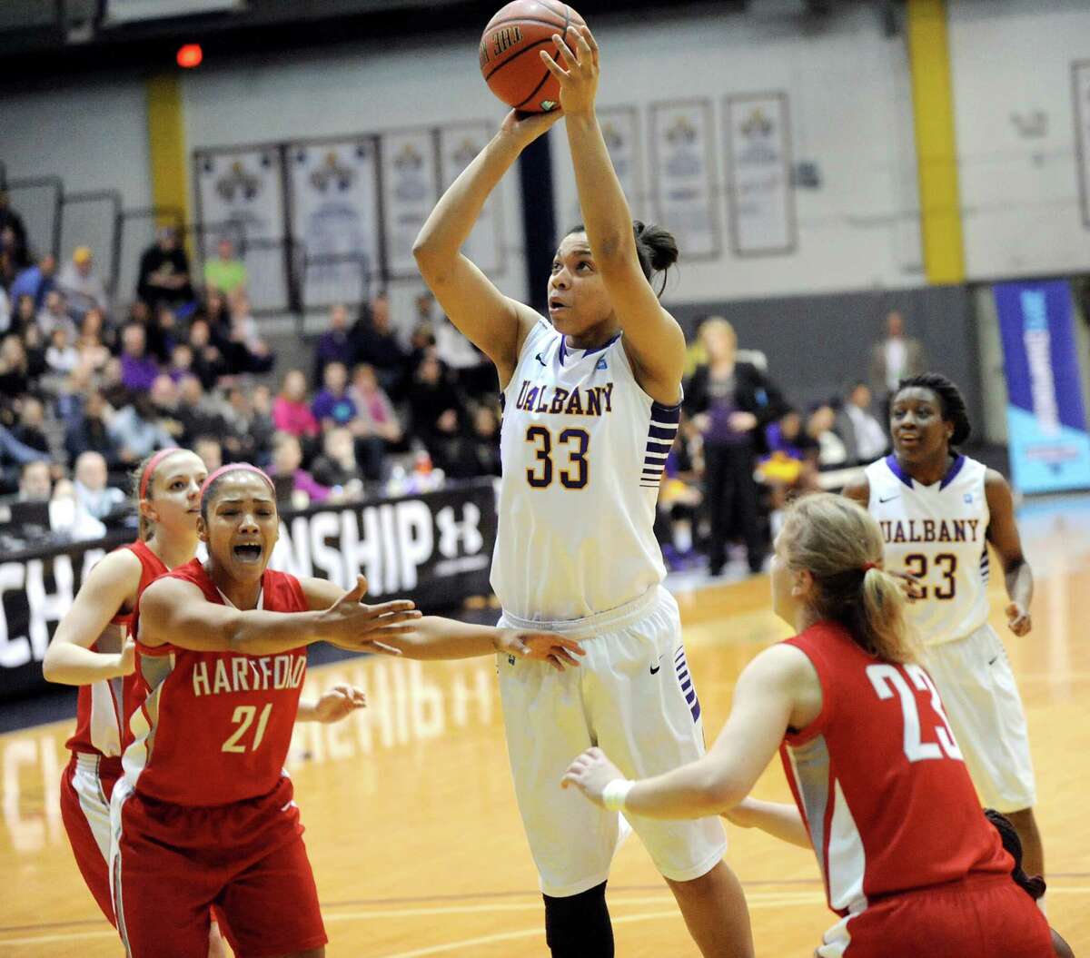 UAlbany's Tiana-Jo Carter, center, goes to the hoop during their America East Championship game against Hartford on Friday, March 13, 2015, at UAlbany in Albany, N.Y. (Cindy Schultz / Times Union)