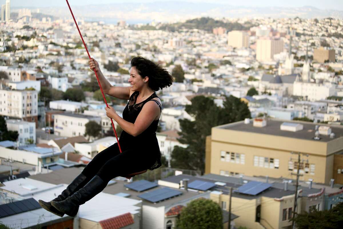 Lili Katz swings on a rope swing she brought to the park in Billy Goat Hill Park in Noe Valley San Francisco, Calif., Thursday March 12, 2015.
