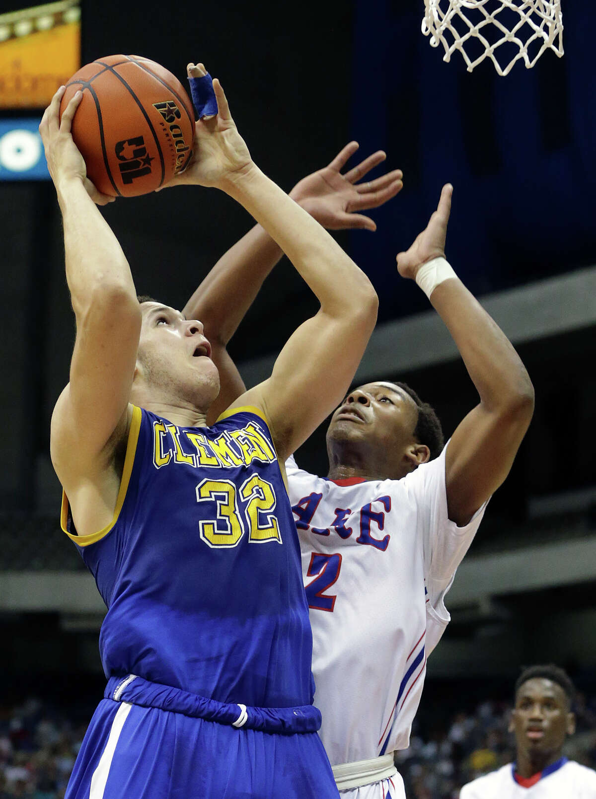 Buffalo forward Cayne Edwards takes the ball up against Bradley George as Clemens plays Houston Clear Lake in the 6A semifinals of the UIL state basketball tournament at the Alamodome in San Antonio on March 13, 2015.