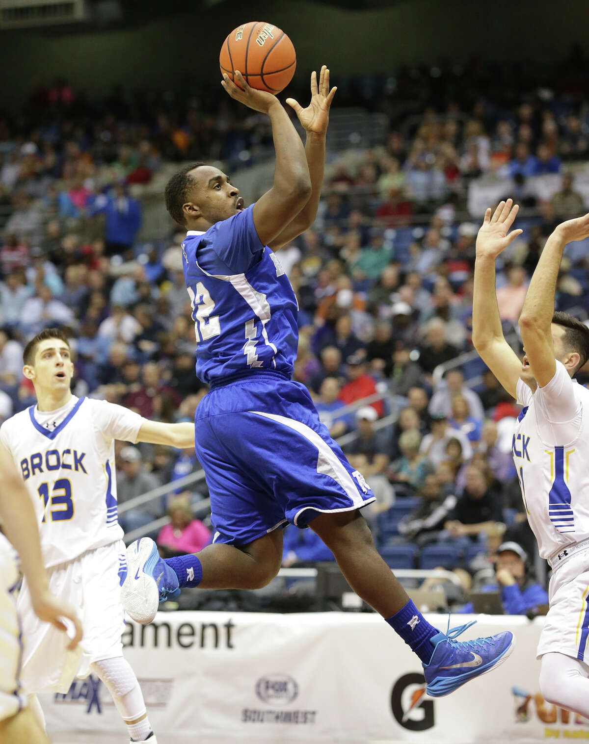 Ro-Hawk center Bryan London gets off a runner in the lane as Randolph plays Brock in the 3A finals of the UIL state basketball tournament at the Alamodome in San Antonio on March 14, 2015.