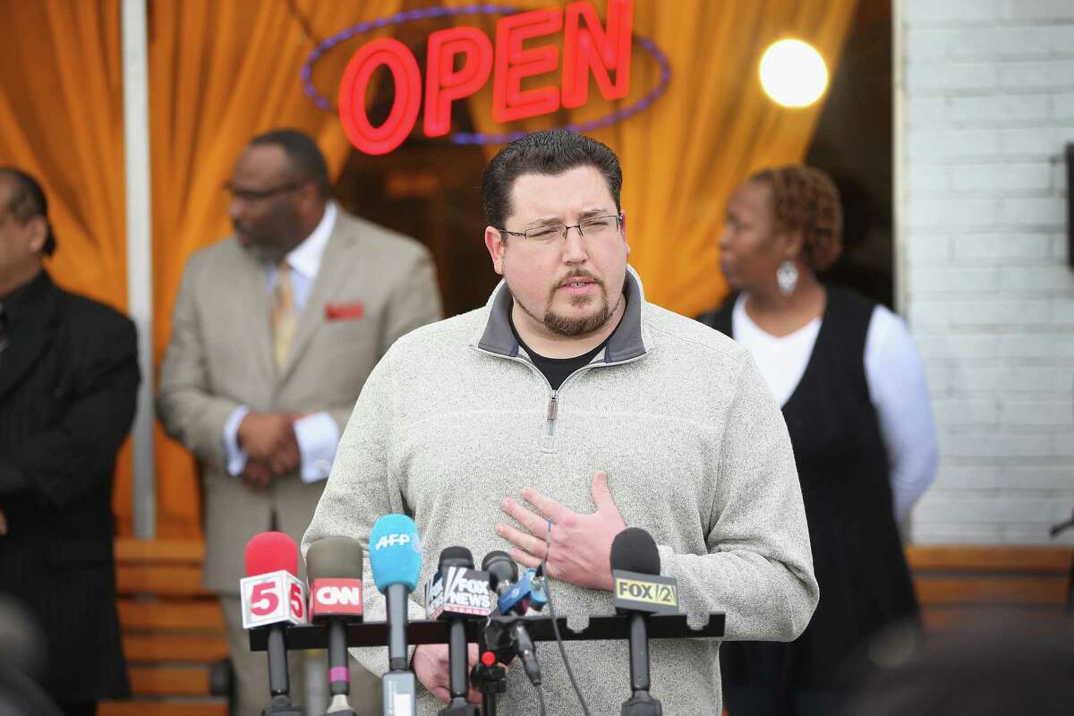 Mayor James Knowles joins with business owners to speak to the press outside a restaurant in Ferguson, Mo. The town’s voters go to the polls on April 7.