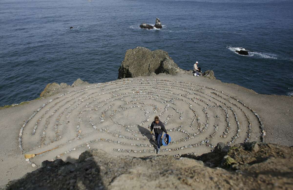 After being away on vacation, Colleen Yerge, known as the keeper of the Lands End Labyrinth, fixes up the labyrinth in San Francisco, Calif.