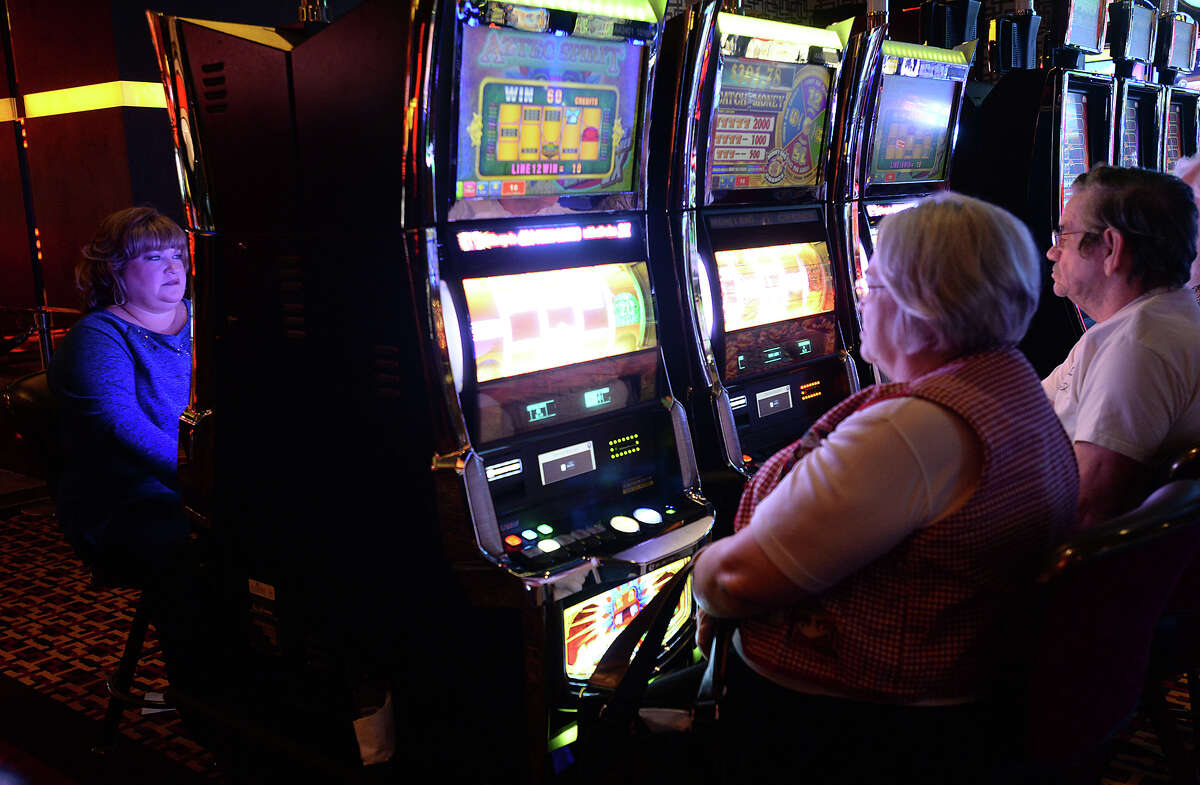 Patrons fill the rows of slot machines on the opening day of the Golden Nugget Casino in Lake Charles, LA, Monday. Photo taken Monday, December 8, 2014 Kim Brent/The Enterprise