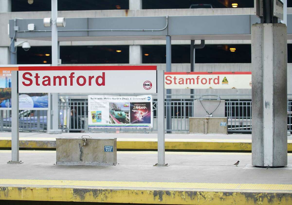 Stamford train station with garage that is to be replaced with a development planned to have retail, residential, commercial and a hotel included in it.