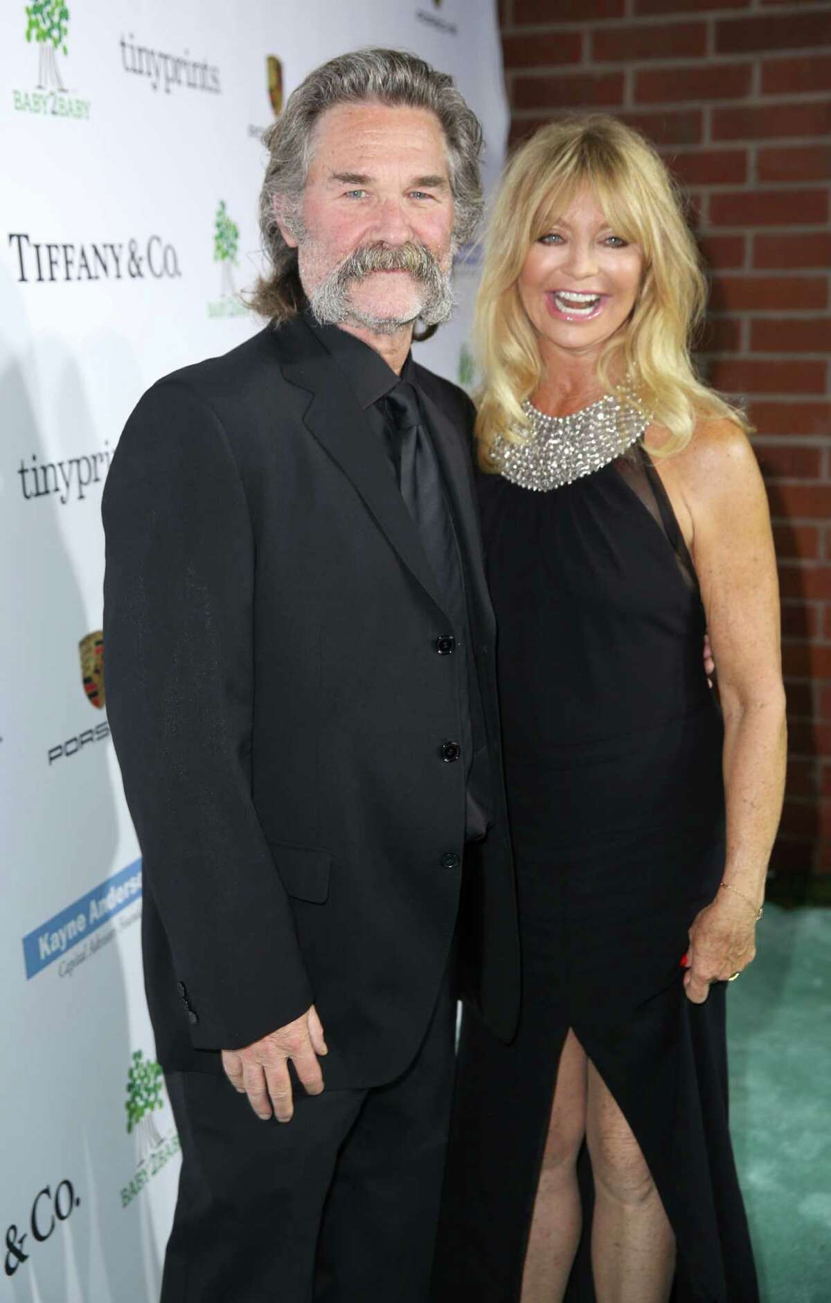 Kurt Russell, left, and Goldie Hawn arrive at the Third annual Baby2Baby Gala honoring Kate Hudson at The Book Bindery on Saturday, Nov. 8, 2014, in Culver City, Calif. (Photo by Matt Sayles/Invision/AP) ORG XMIT: CABR117
