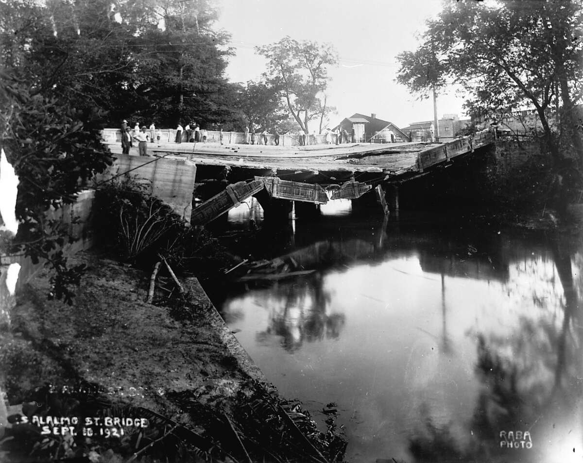 Alamo Street Bridge. 1921. Flood damage to Alamo Street Bridge. Thirteen of the city's twenty-seven bridges were destroyed in the flood that swept San Antonio on September 9-10, 1921. The flood acted as the impetus for flood control measures and river improvements that culminated in Robert H.H. Hugman's San Antonio River Walk. Alamo bridge (RABA COLLECTION)