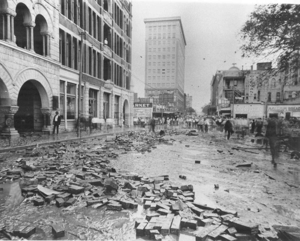 Mesquite block paving on Navarro Street between the river and College Street floated up during the 1921 flood.