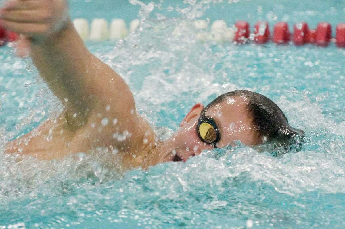 Pomperaug High School's John Feller swims the 200 freestyle during a meet against Brookfield High School held at Pomperaug. Friday, Jan. 16, 2015
