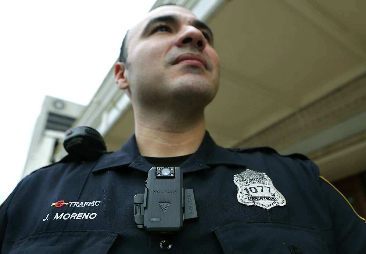 San Antonio Police Officer Johnny Moreno wears a body cam that Chief William McManus spoke to members of city counsel about to be used by certain police officers, if the cameras are approved. Wednesday, Dec. 10, 2014.