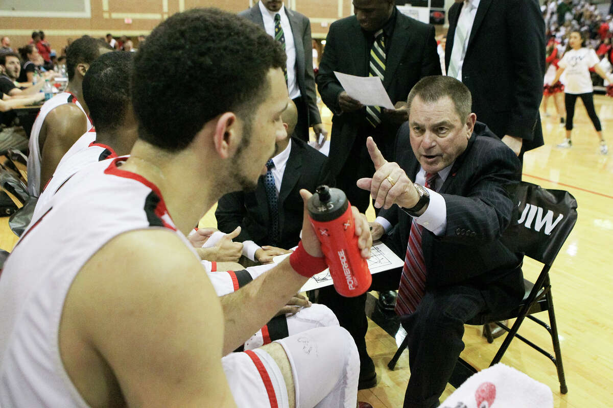 UIW coach Ken Burmeister talks to the Cardinals during the second half of their first round game with Louisiana-Lafayette in the CollegeInsider.com Tournament at the McDermott Convocation Center on March 17, 2015.