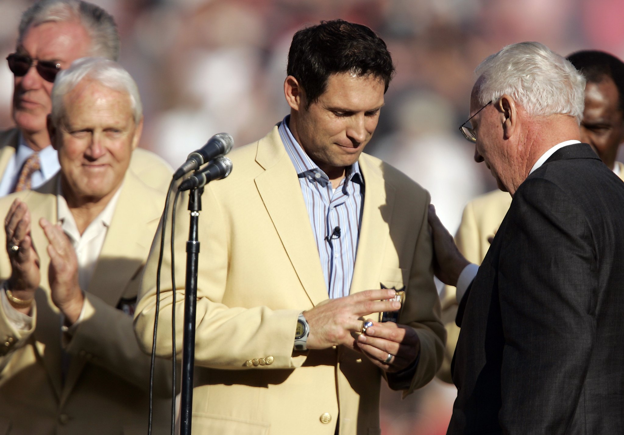 FILE - San Francisco 49ers quarterback Steve Young upends Dallas Cowboys  cornerback Deion Sanders after Sanders intercepted Young in the first  quarter of their Sunday, Nov 2, 1997, game in San Francisco.