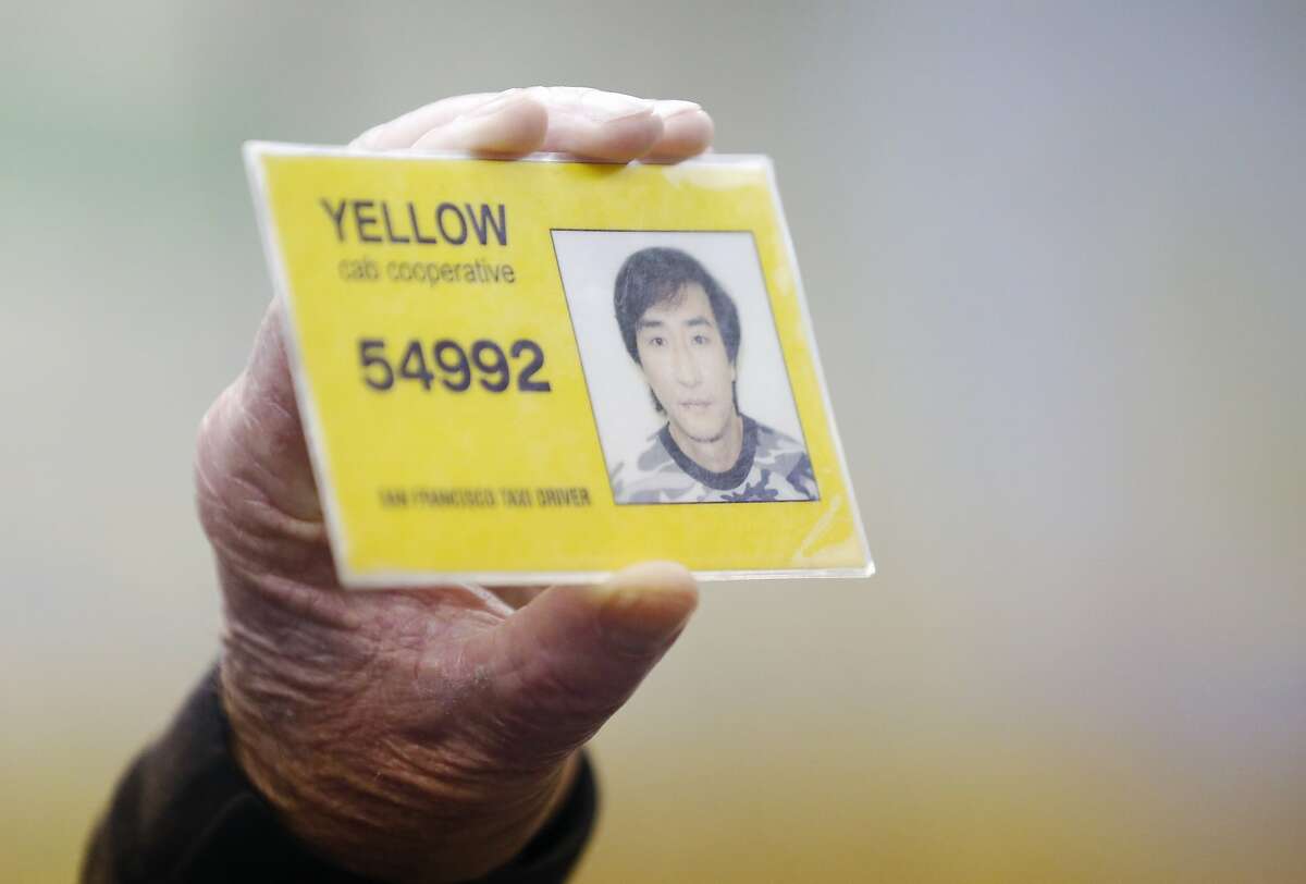 Instructor Mickey Kelley holds up an artificial example of a taxi ID during class at San Francisco Taxi School at the DeSoto Cab and Flywheel headquarters March 18, 2015 in San Francisco, Calif.