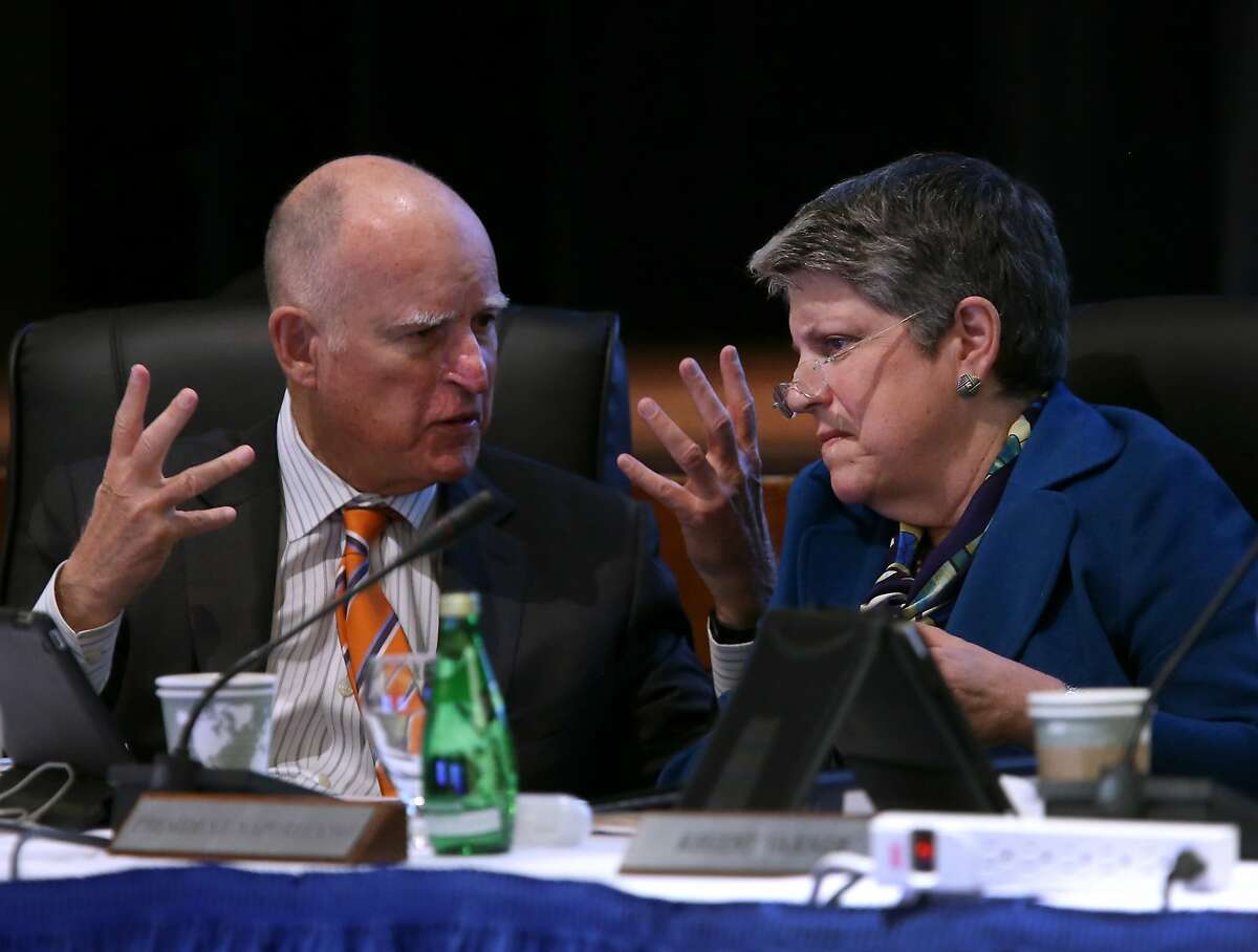 Gov. Jerry Brown and University of California President Janet Napolitano confer before discussing proposed tuition hikes during the UC Board of Regents meeting at the UCSF Mission Bay campus in San Francisco, Calif. on Wednesday, March 18, 2015.
