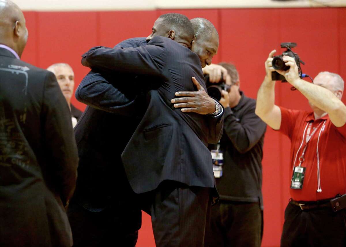 Former players Hakeem Olajuwon, left, and Vernon Maxwell at a photo shoot honoring the Houston Rockets 20th anniversary of the 1993-94 and 1994-95 NBA back-to-back champion teams at the Toyota Center Thursday, March 19, 2015, in Houston, Texas.