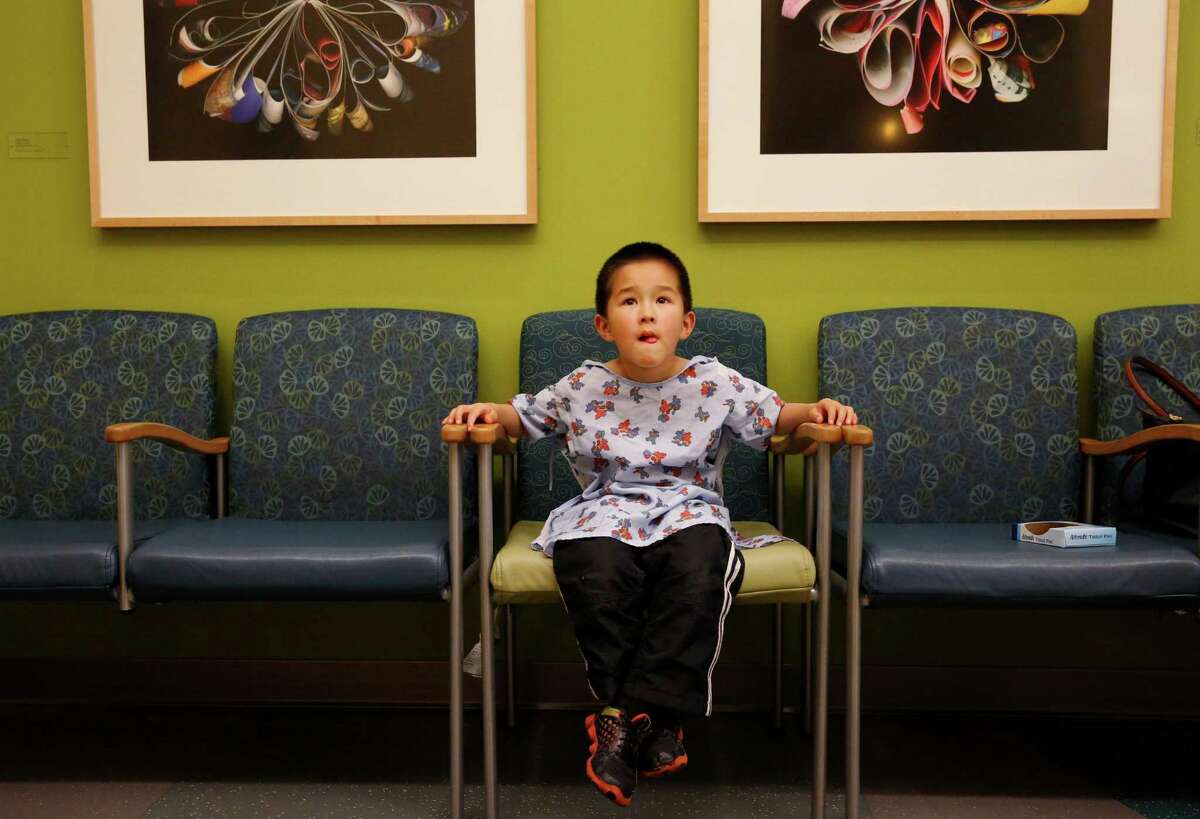 Alex, 5, (whose mother preferred to withhold his last name) watches a movie as his back itches while he waits for the allergens applied to it to set in during a skin test in the Kaiser Permanente Allergy Department March 18, 2015 in Sunnyvale, Calif.