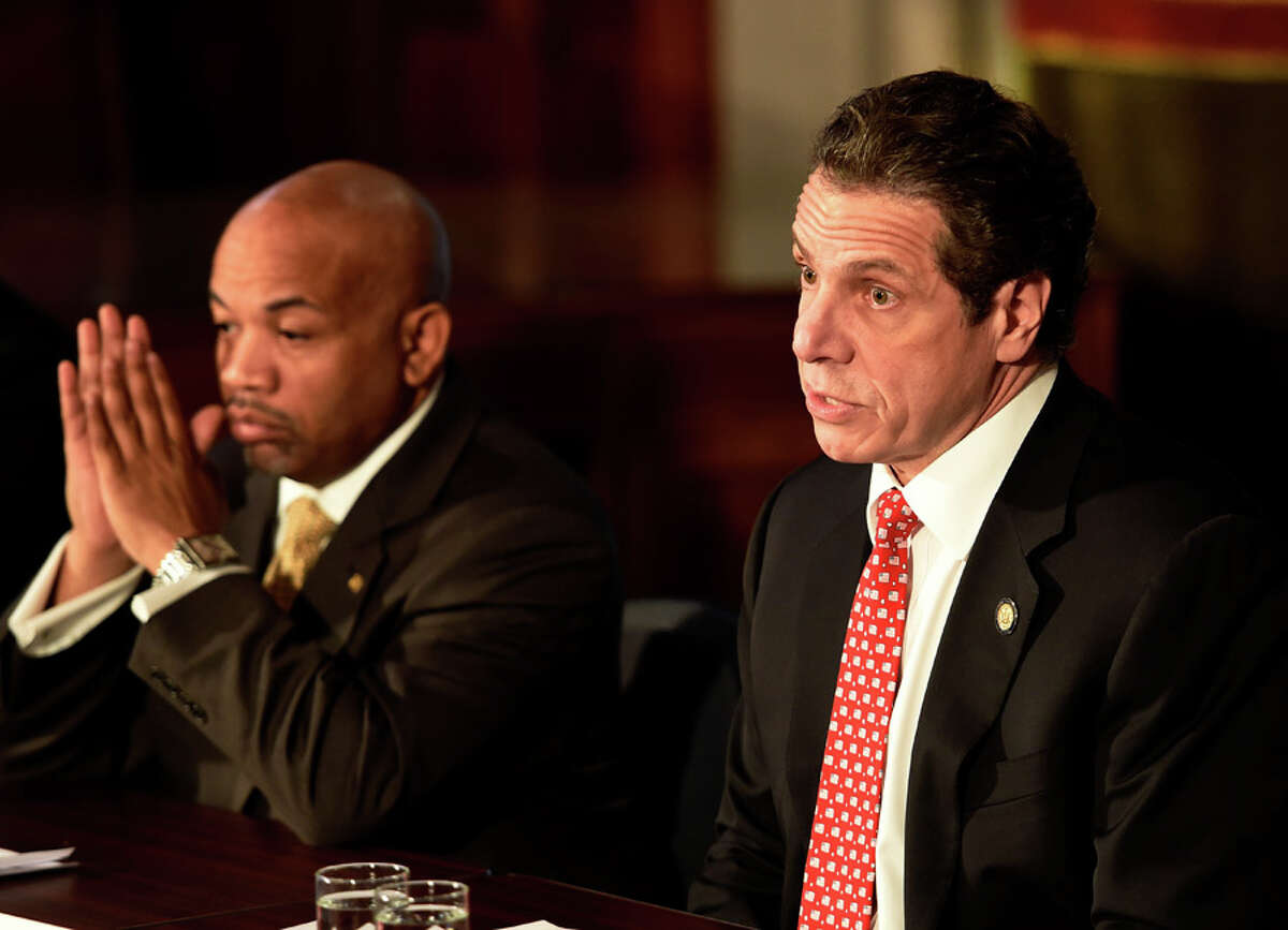 Gov. Andrew Cuomo, right and Assembly Democratic Majority Speaker Carl Heastie announced details of a two-way ethics reform agreement they reached Tuesday night during a press conference Wednesday morning March 18, 2015 in the Red Room of the Capitol in Albany, N.Y. Highlights include a swipe card requirement for lawmakers claiming per diems and detailed outside income disclosure. (Skip Dickstein/Times Union)