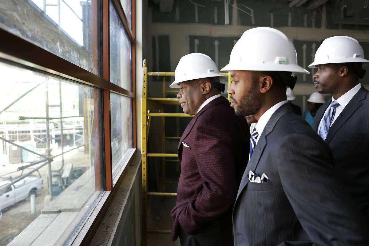 Former Mayor Willie Brown (left), and incoming principal Demetrius Hobson, (center) tour the new Willie Brown Middle School in the Bayview Neighborhood of San Francisco on Thursday, March 19, 2015. Brown's visit came as district officials were announcing assignment numbers for the school this fall.
