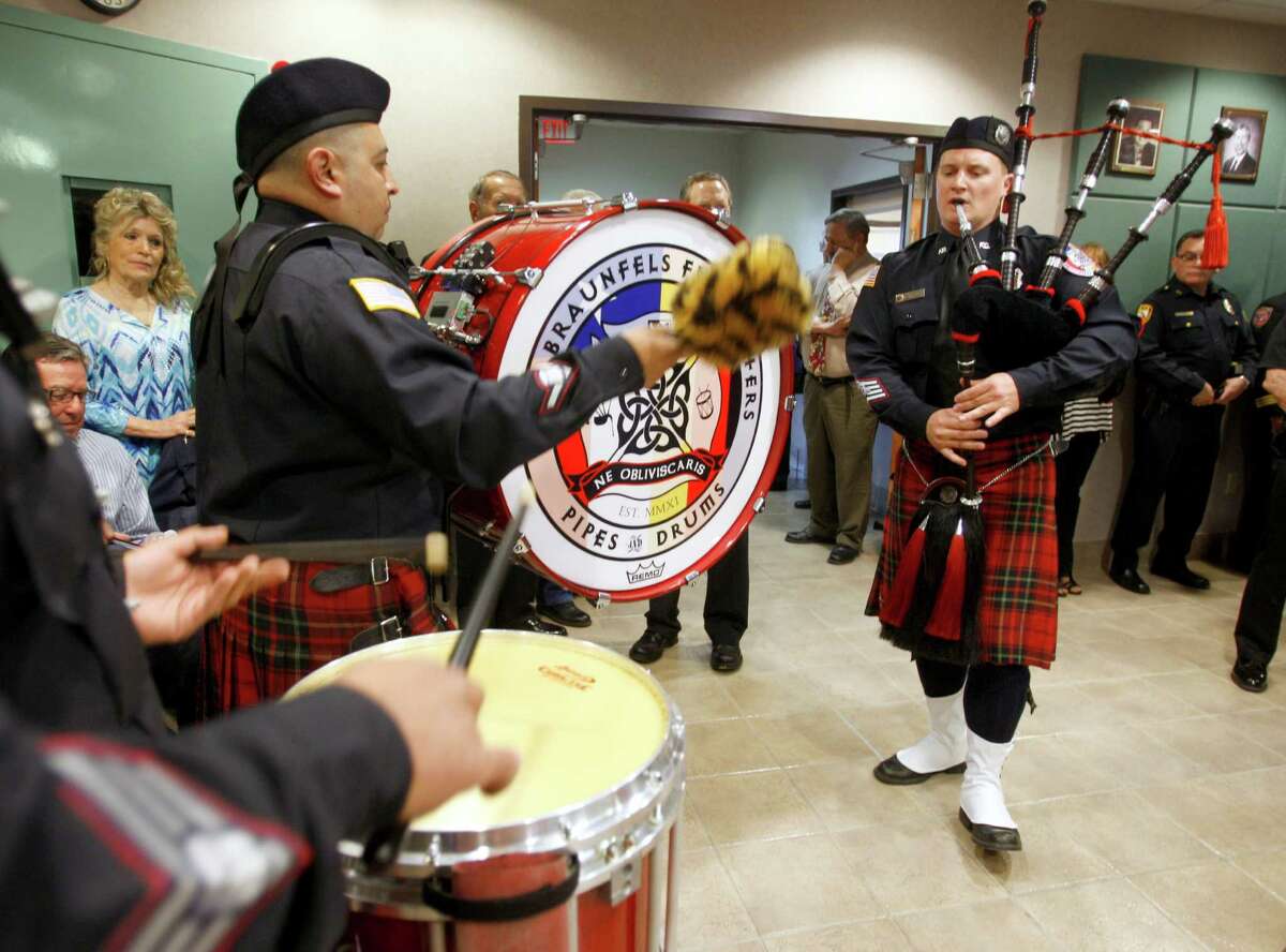 The New Braunfels Firefighters Pipes & Drums play at the beginning of the swearing-in ceremony Thursday, March 19, 2015 for Balcones Heights' new police and fire chiefs.