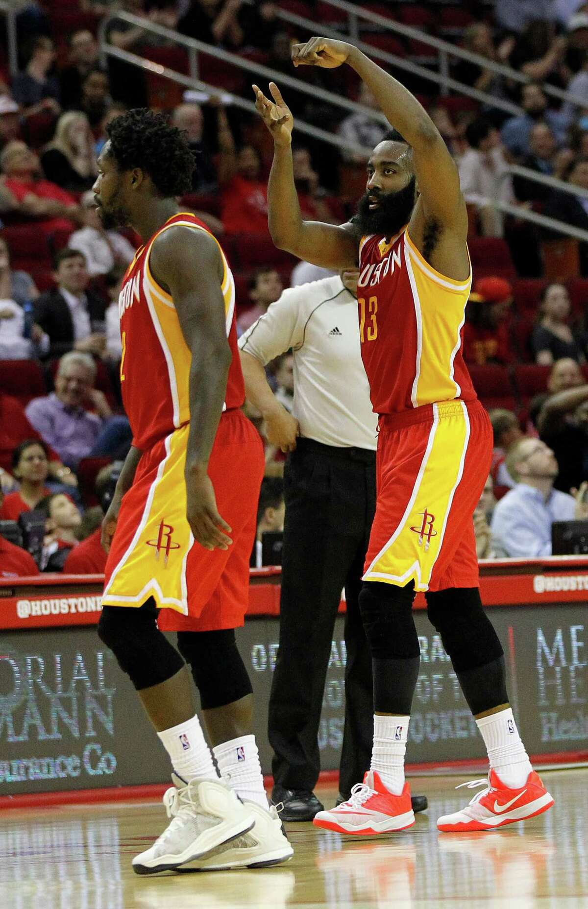 Houston Rockets James Harden signals stirring the pot as he walks back to the bench for a time out during the third quarter of an NBA game at Toyota Center, Thursday, March 19, 2015, in Houston.