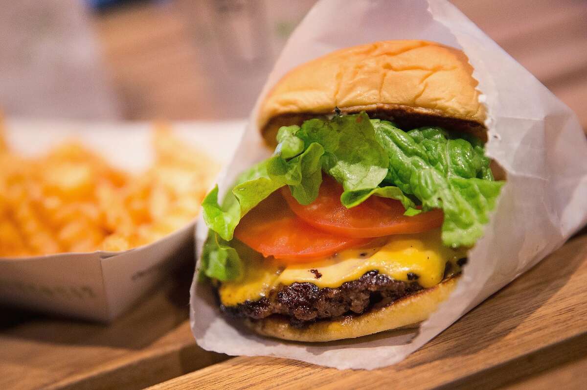 A cheeseburger and french fries are served up at a Shake Shack restaurant on January 28, 2015 in Chicago, Illinois. The burger chain, with currently has 63 locations, is expected to go public this week with an IPO priced between $17 to $19 a share.