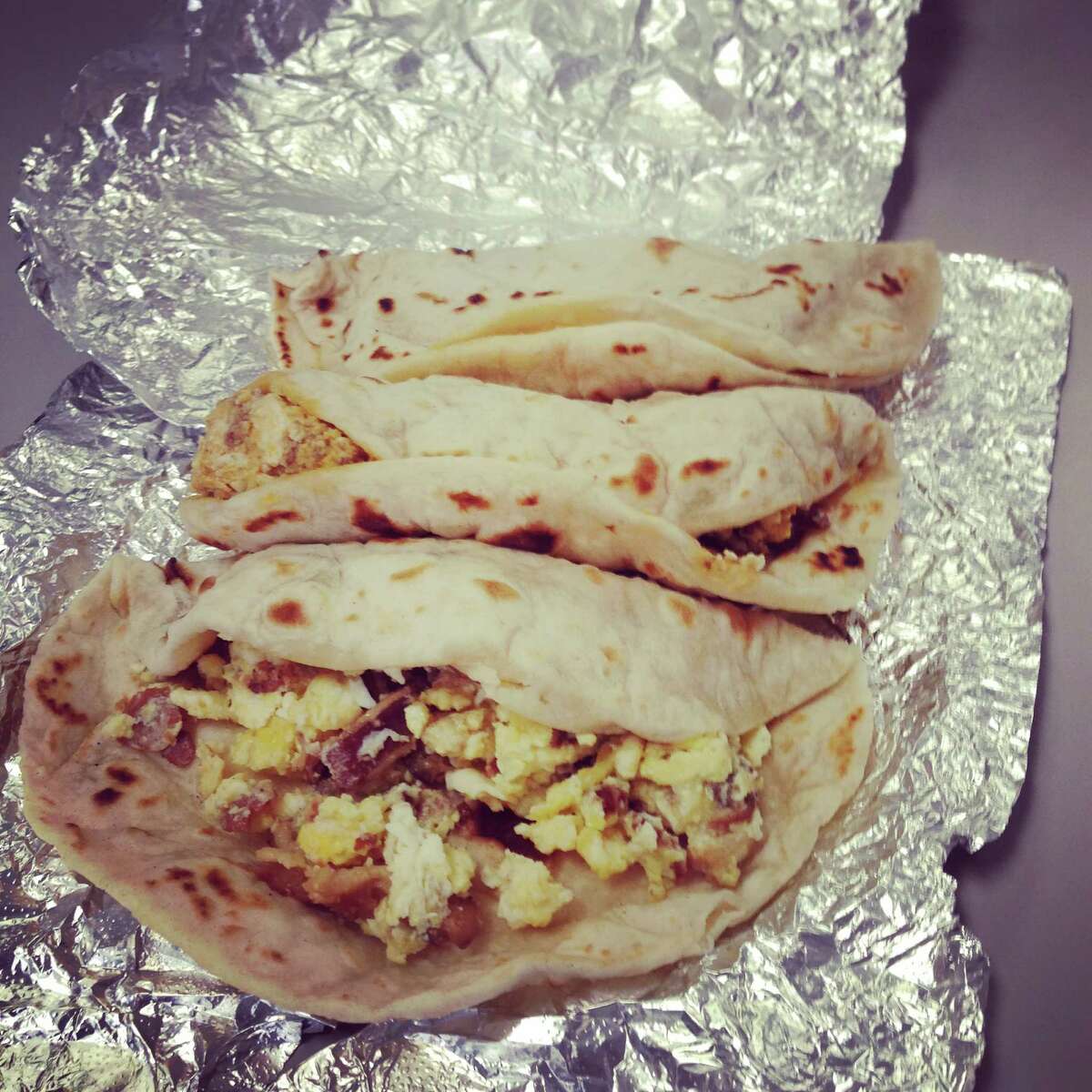 1. We can foil the foil  San Antonian breakfast taco lovers don't have to unwrap the aluminum foil to know what kind of taco lies beneath. All we have to do is give it a little feel and squeeze to know if it's a bacon and egg or bean and cheese.  Slighty squishy? That's a bacon and egg.  Very squishy? You've got yourself a bean and cheese. 