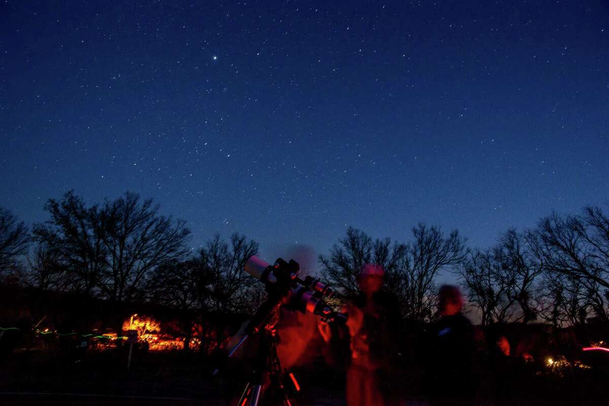 Amateur astronomers study the stars over Enchanted Rock State Park during a park event Saturday, Feb. 21, 2015. The park was celebrating being named a Gold Tier Dark Skies park by the International Dark Skies Association. Photo by Joshua Trudell/For the Express-News Amateur astronomers study the stars over Enchanted Rock State Park during a recent sky viewing event. Photo by Joshua Trudell/For the Express-News