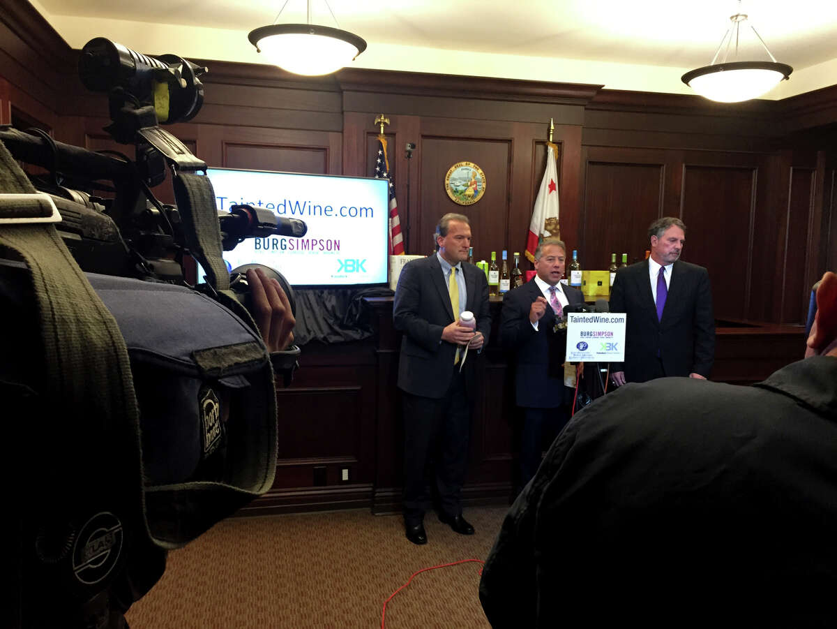 Attorneys David K. TeSelle (left), Brian S. Kabateck and Michael S. Burg announce the filing of the lawsuit in Los Angeles, alleging that many popular, low-priced wines contain dangerously high levels of arsenic.