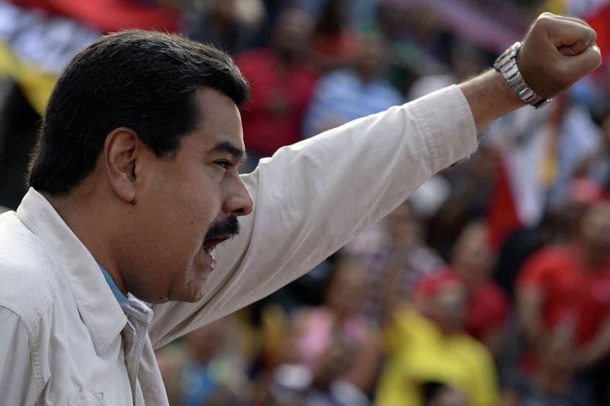 Venezuelan President Nicolas Maduro delivers a speech before supporters gathering outside the presidential palace in Caracas on March 12. Maduro has launched a crackdown on the opposition, saying they are doing Washington's work in trying to oust him and other left-wing leaders in Latin America.