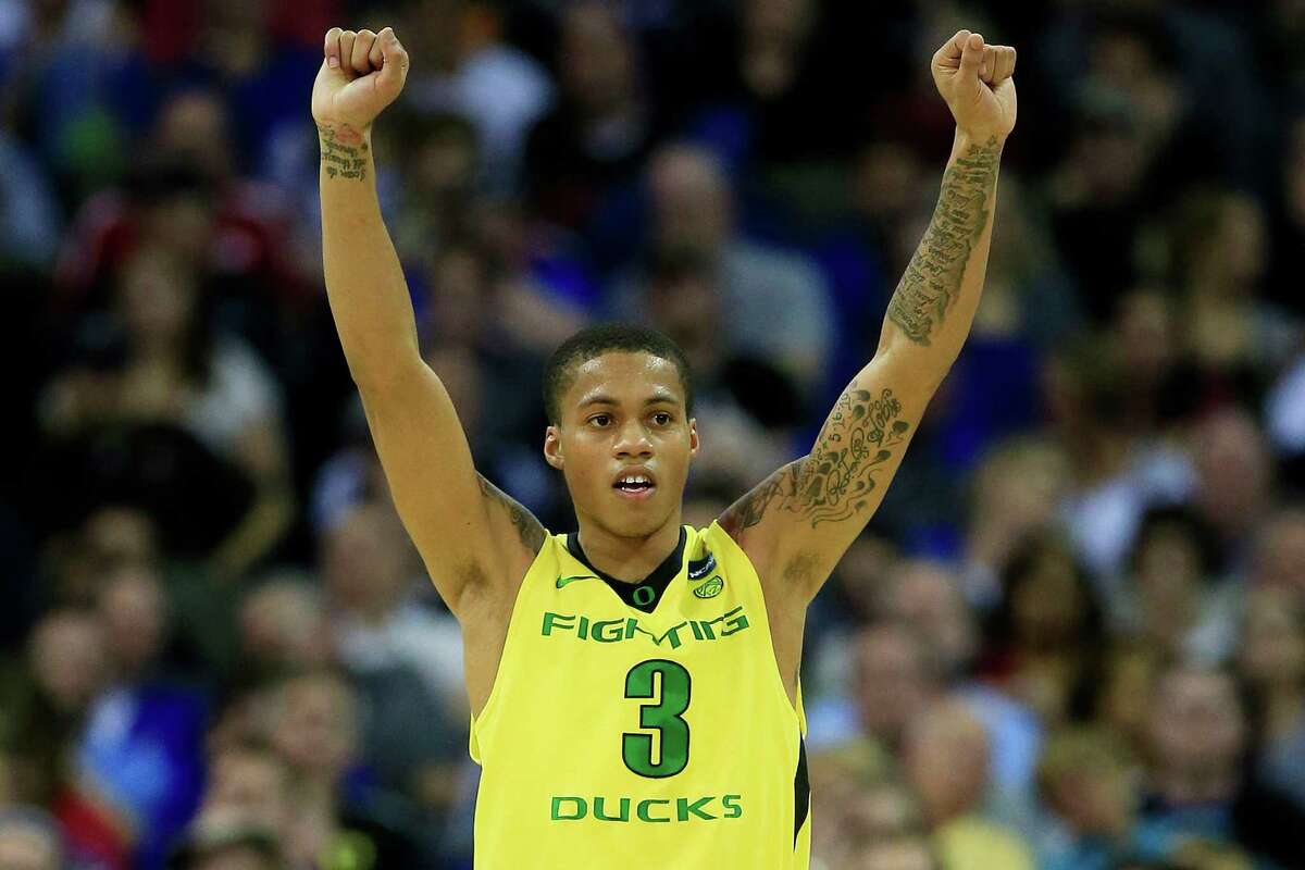 OMAHA, NE - MARCH 20: Joseph Young #3 of the Oregon Ducks celebrates in the second half against the Oklahoma State Cowboys during the second round of the 2015 NCAA Men's Basketball Tournament at the CenturyLink Center on March 20, 2015 in Omaha, Nebraska.