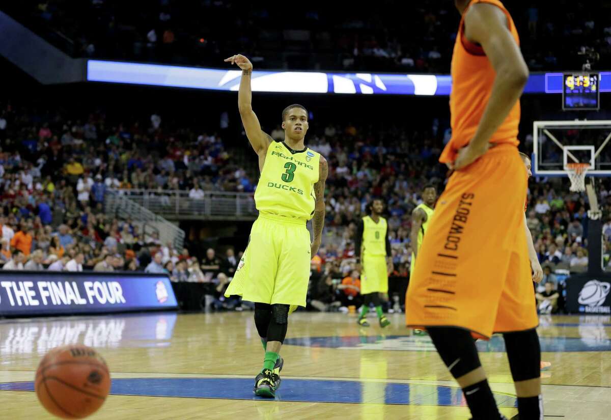 Oregon guard Joseph Young reacts at the end of an NCAA tournament college basketball game against Oklahoma State in the Round of 64, Friday, March 20, 2015, in Omaha, Neb. Young scored 27 points as Oregon won 79-73. (AP Photo/Charlie Neibergall)