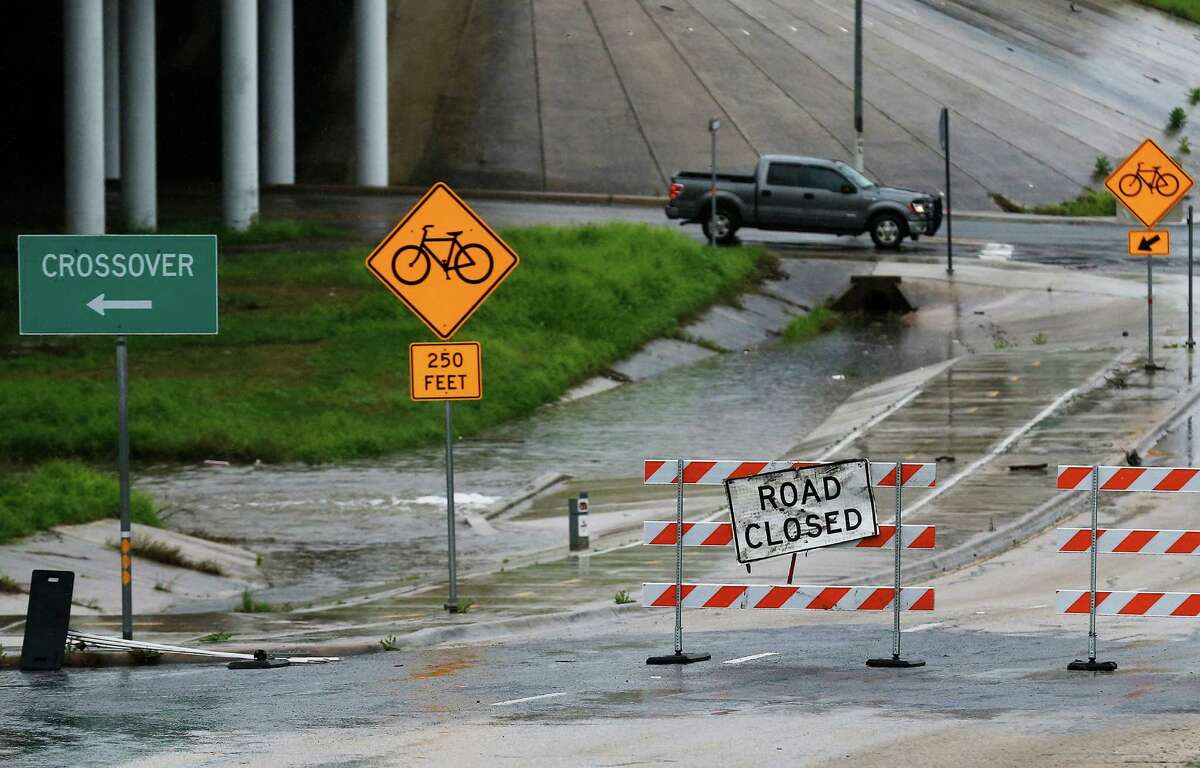 Barricades shut off the service access road along Interstate 35 near Splashtown due to potential flooding along Salado Creek on Saturday, Mar. 21, 2015. Weather officials warned the area for possible urban and small stream flooding due to the buildup of rain overnight and through the day. (Kin Man Hui/San Antonio Express-News)