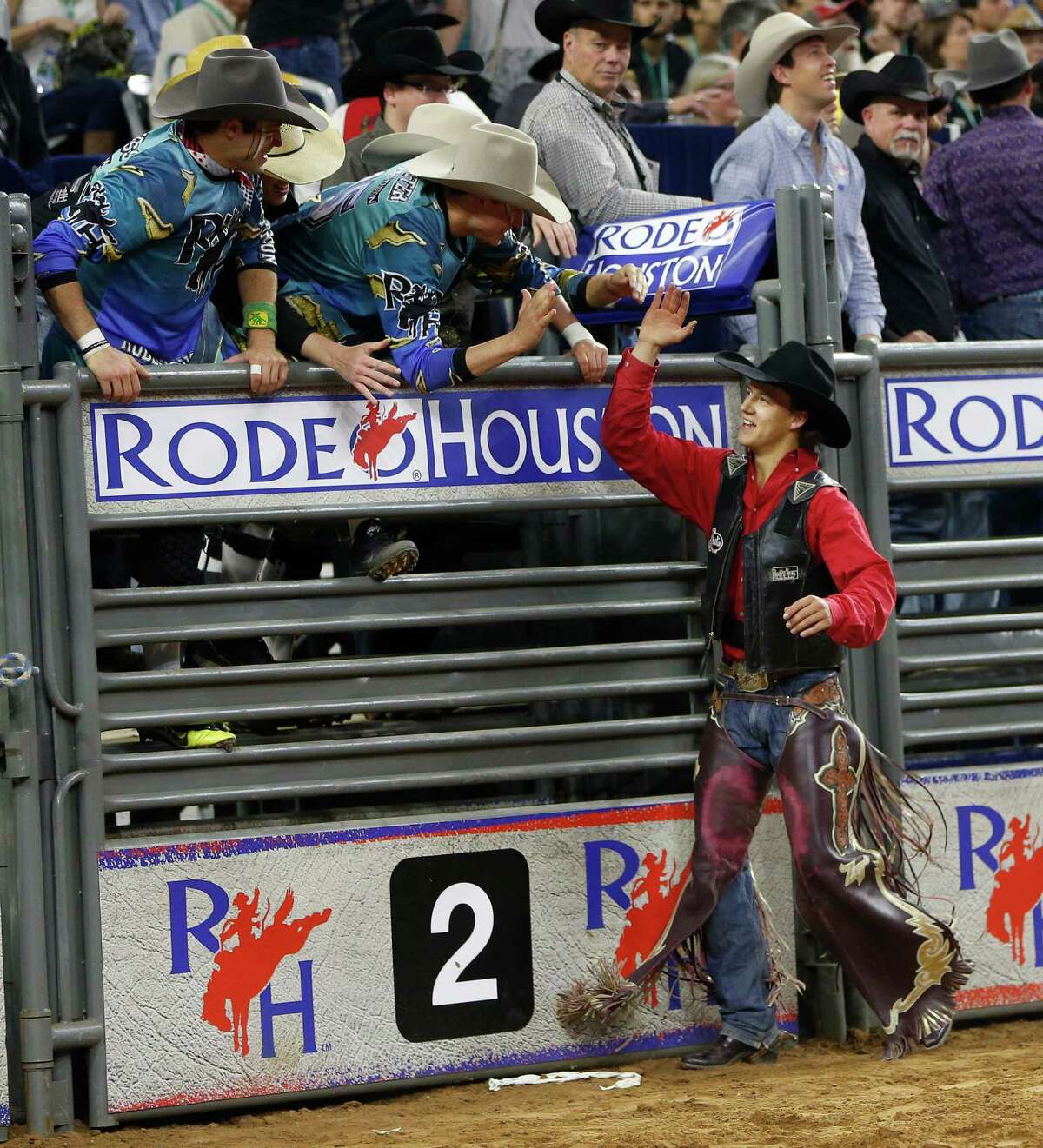 Saddle bronc rider Zeke Thurston, bull rider Sage Kimzey and barrel racer Nancy Hunter, from left, were pumped up after winning Saturday's championship shootout in their respective events.