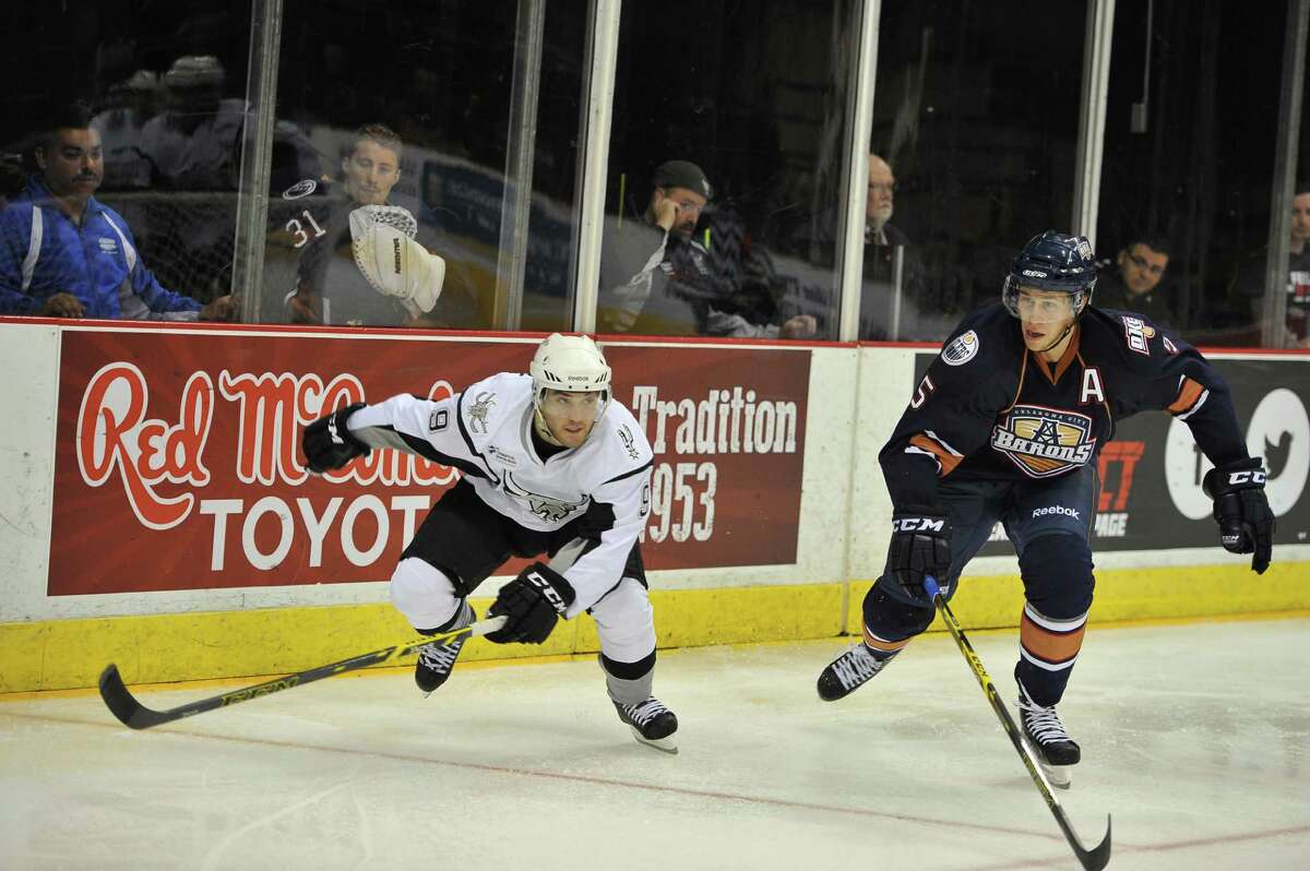 Rampage center Rocco Grimaldi (left), shown during a recent game against Oklahoma City at the AT&T Center, knows his 5-foot-6, 160-pound size makes him an easy target inside the locker room.