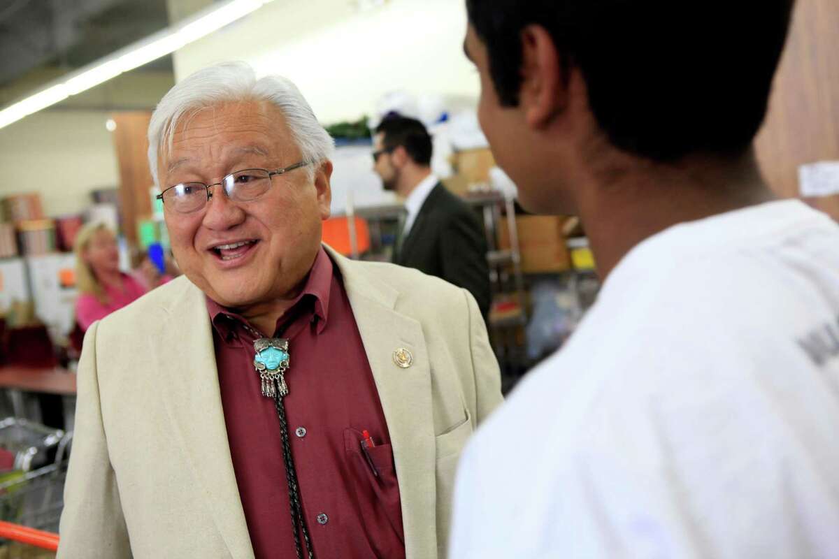 Rep. Mike Honda talks with constituents at the Sunnyvale Community Services building, where he helped hand out back-to-school backpacks in August.