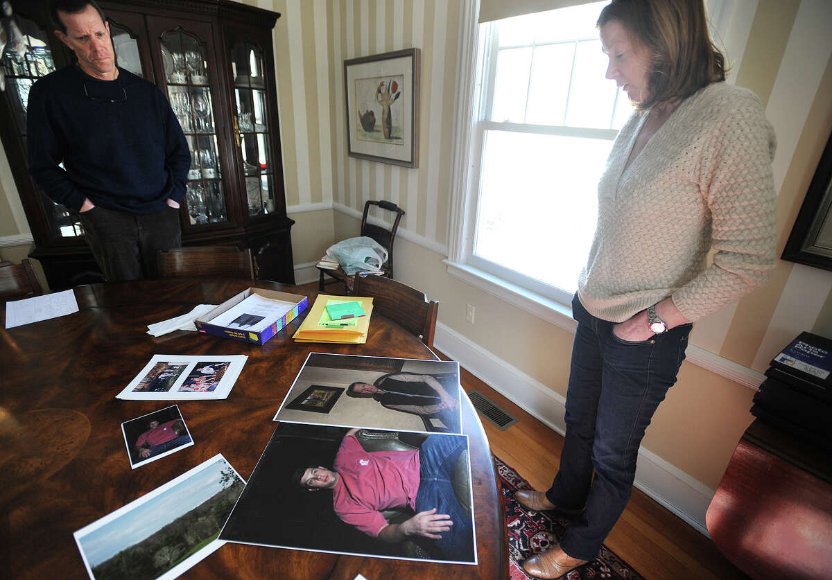 Ivan Maisel and Meg Murray, parents of Max Maisel, looks over some of their son's photographs at their home in Fairfield, Conn. on Monday, March 23, 2015. Maisel, 21, a junior at the Rochester Institute of Technology, went missing on February 22 in the vicinity of the Genesee River in upstate New York.