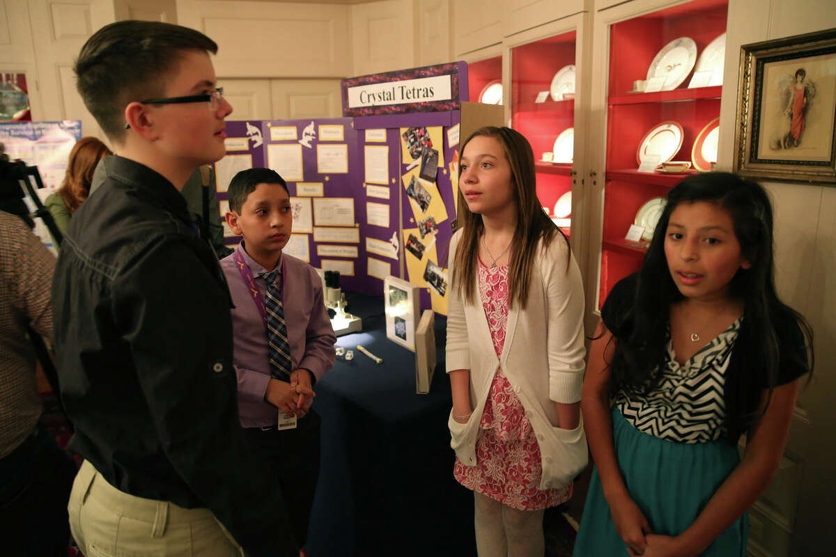 Hobby Middle School students (from left) Tony Holmes, 13; Jacob Rubio, 11; Madelyn Hickman, 11; and Kalista Ybarra, 12, talk among themselves during the White House Science Fair.