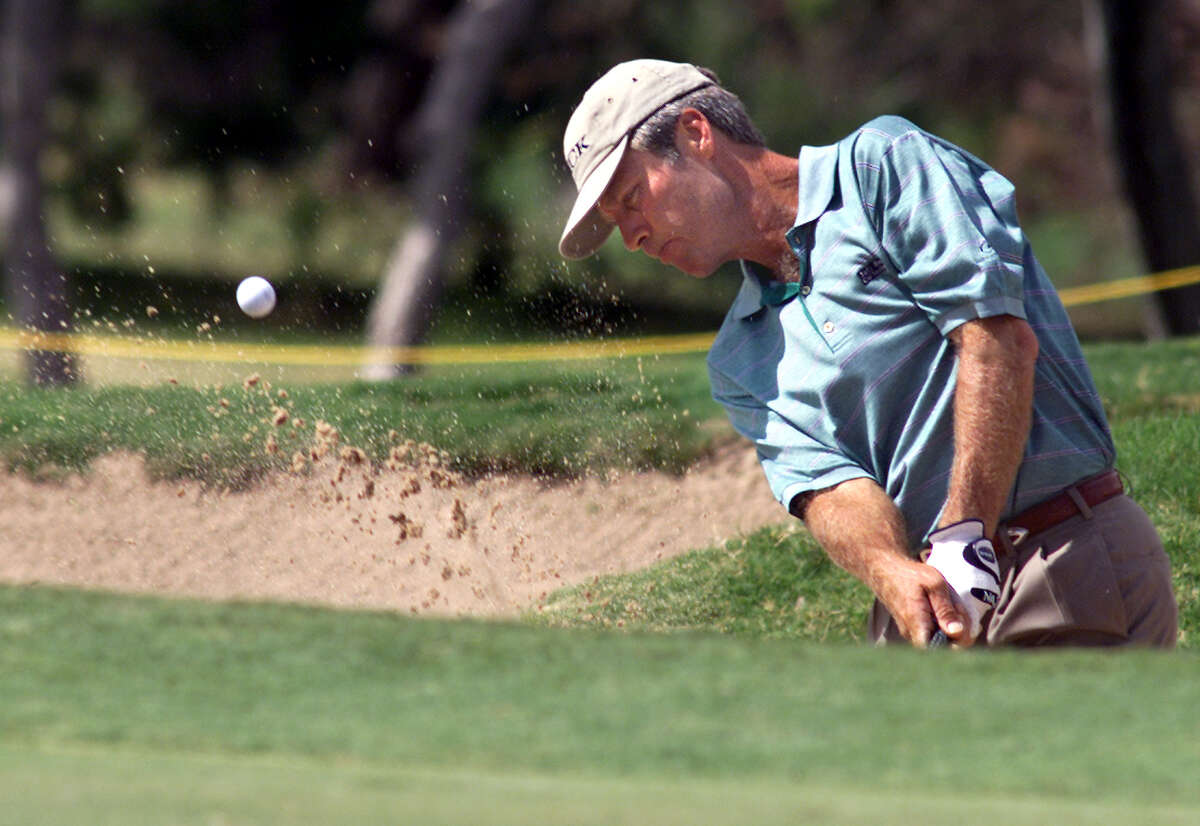 Ben Crenshaw, who won his pro debut at the 1973 Texas Open, blasts out of a greenside sand trap at No.15 at La Cantera, where the pro-am was played on Sept. 20, 2001.