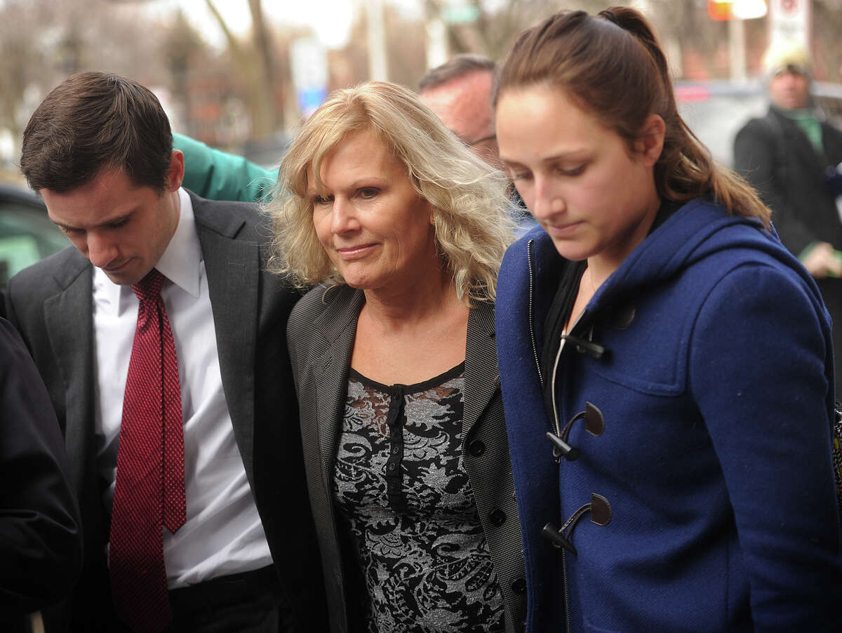 Former 5th Congressional District candidate Lisa Wilson-Foley, center, exits U.S. District Court in New Haven, Conn. after being sentenced to five months in prison for conspiracy to make illegal campaign contributions on Tuesday, March 24, 2015.