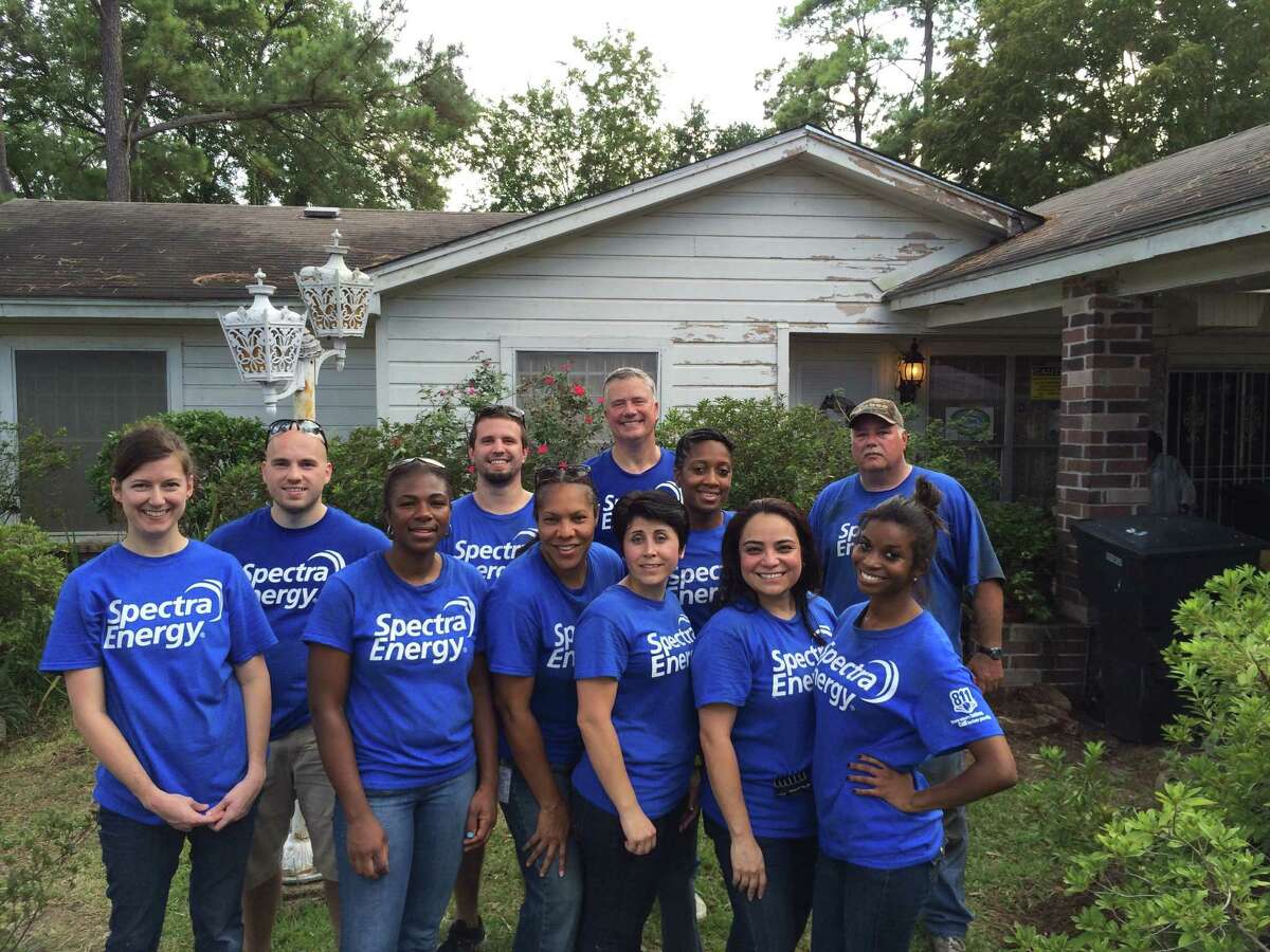 A group of Spectra Energy volunteers helped improve an overgrown yard for an elderly veteran and his wife for September's United Way Day of Caring.